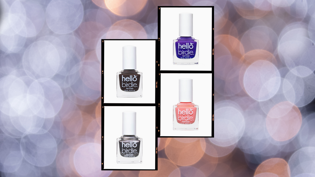 Film strips of four Hello Birdie polishes on a blown out sparkly purple background