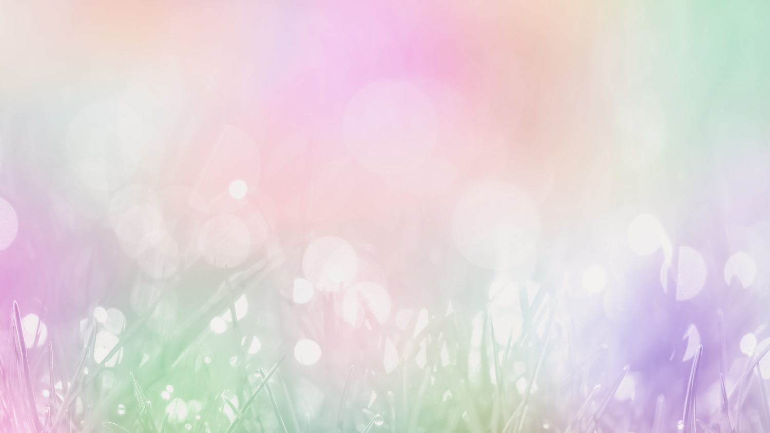 A dreamy, pastel color blend filter over a patch of glistening grass