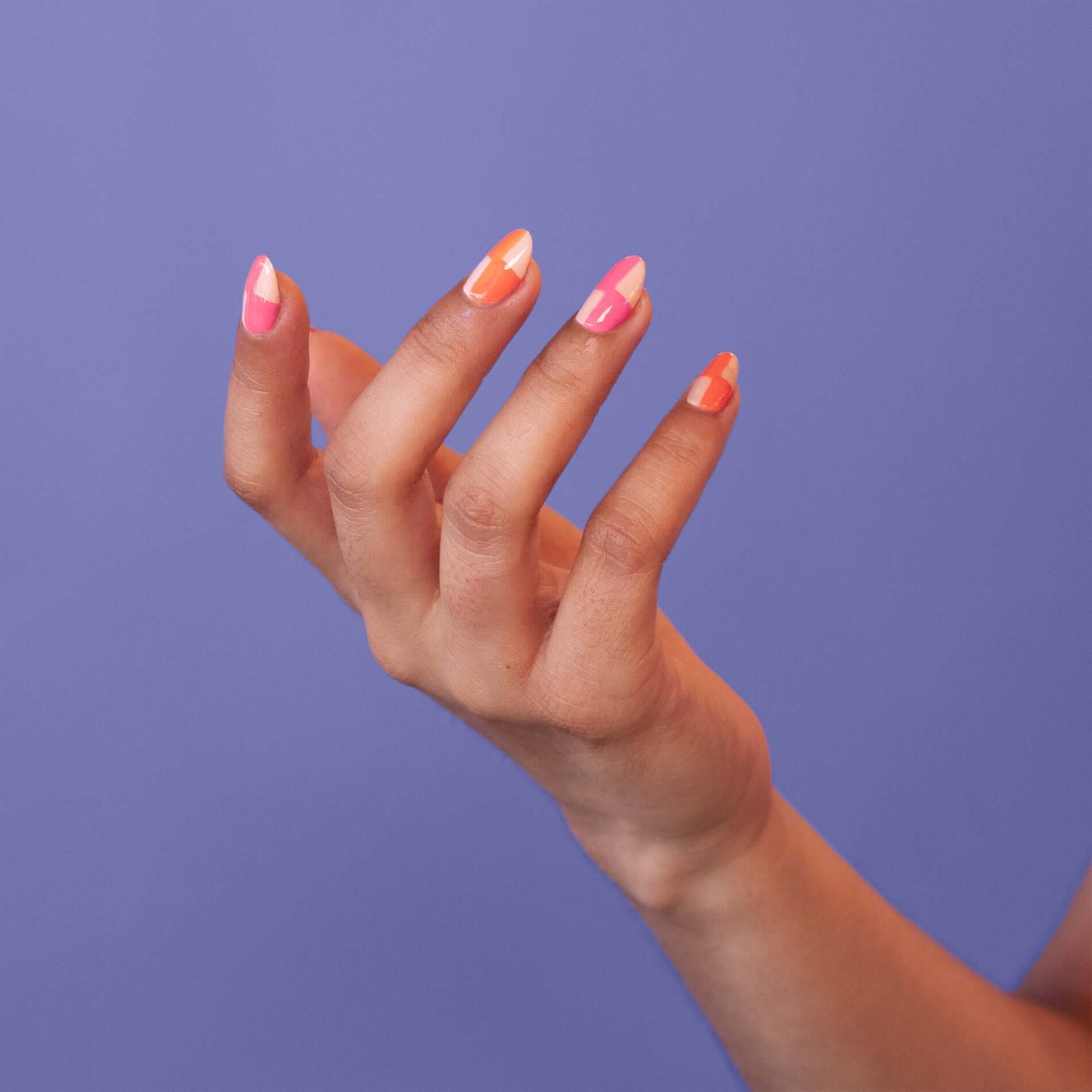 A model with artificial finger nails poses at the stand of 