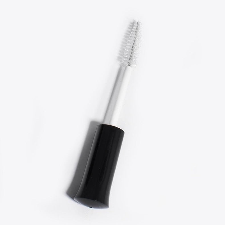 Spoolie brush or mascara wand used to apply lash extension sealant