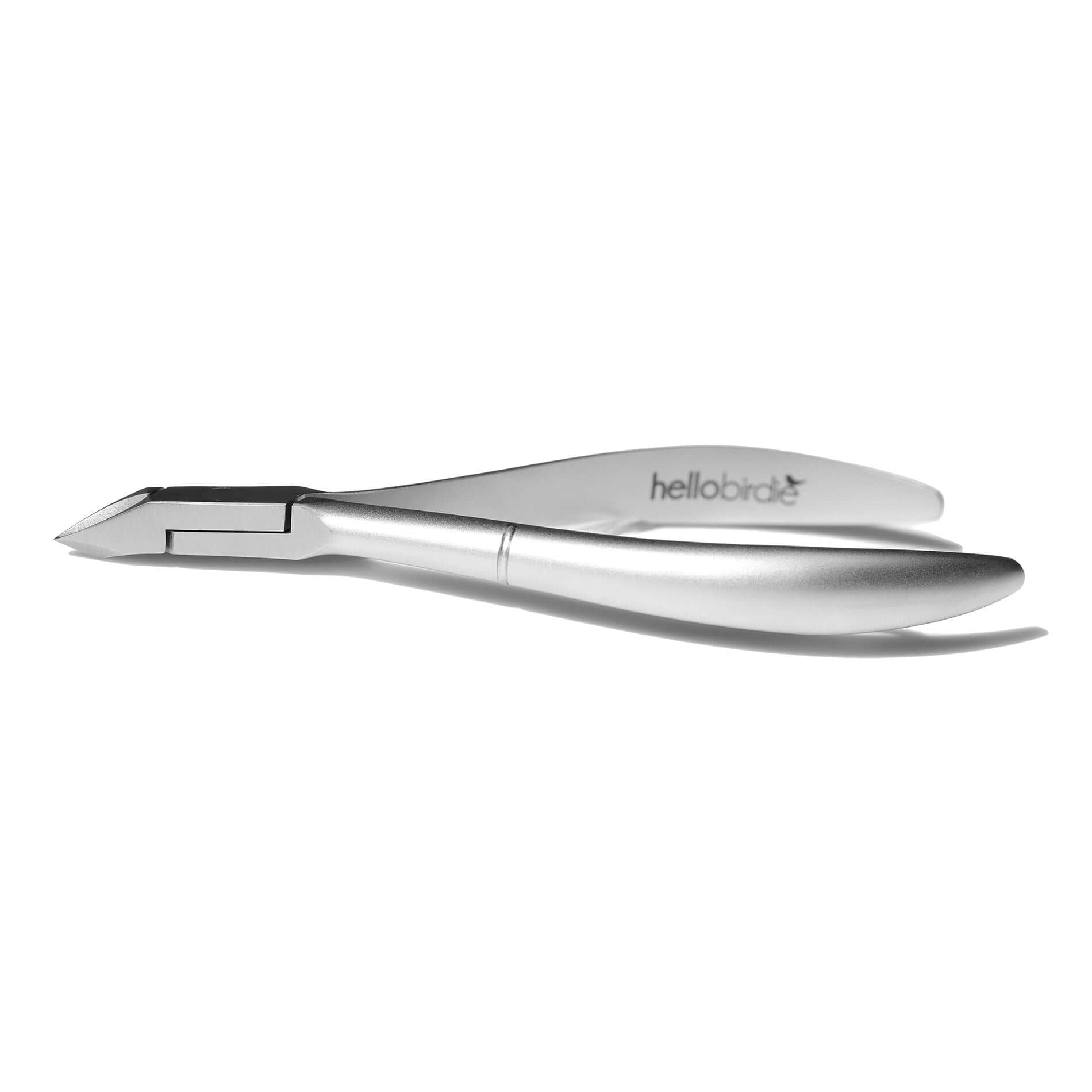 Side view of Hello Birdie cuticle nipper on white background.  Hello Birdie logo located on the inside of the handle.  