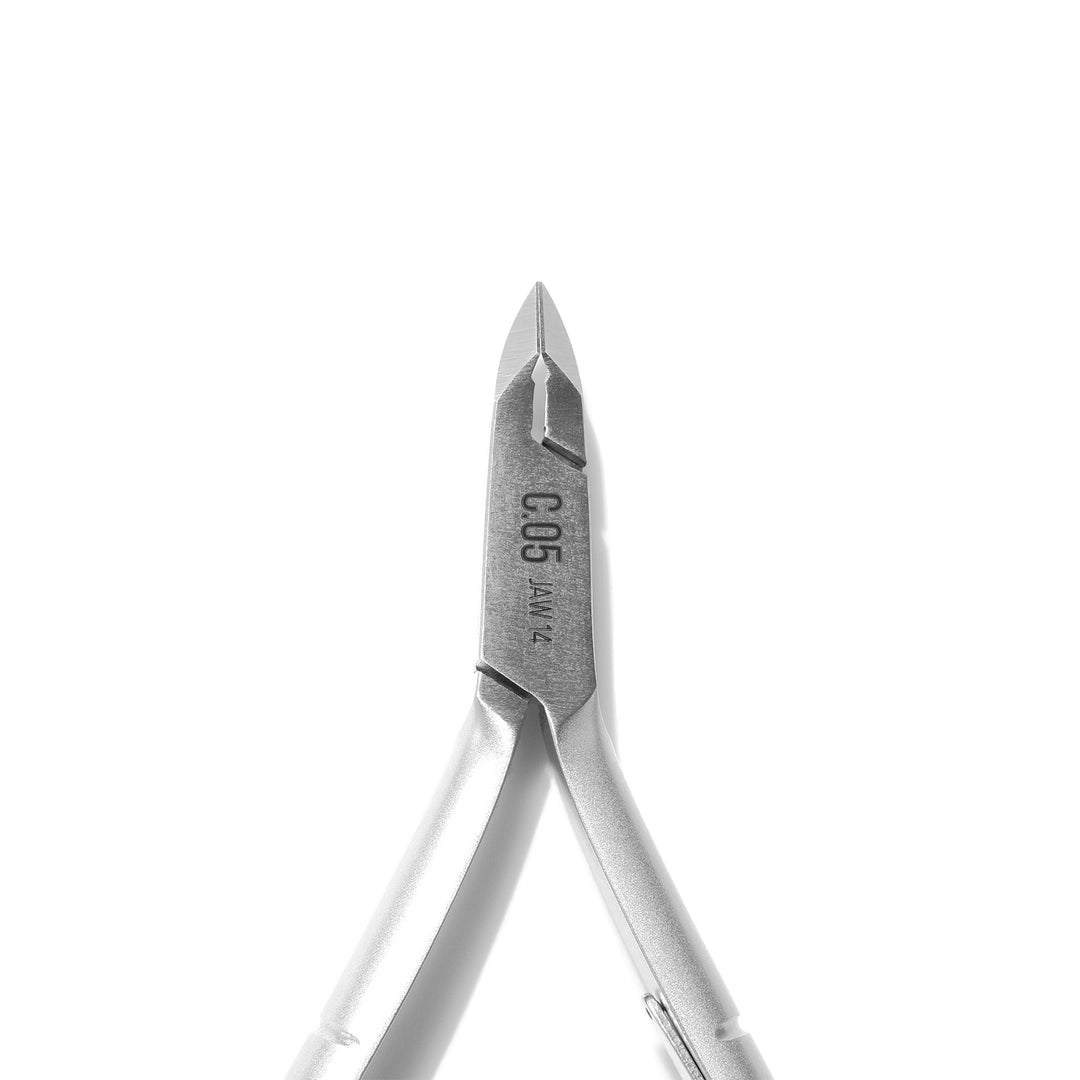 Close up view of ultra sharp, super fine tip of Hello Birdie cuticle nipper on white background